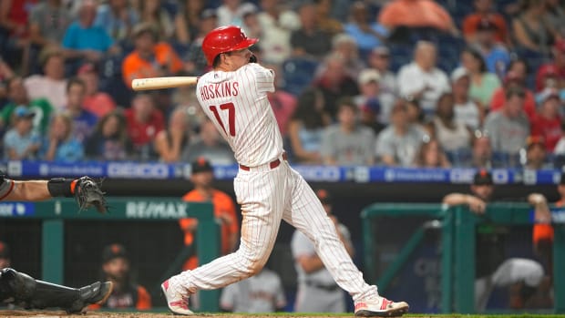 Philadelphia Phillies first baseman Rhys Hoskins hits a single against the SF Giants. (2022)